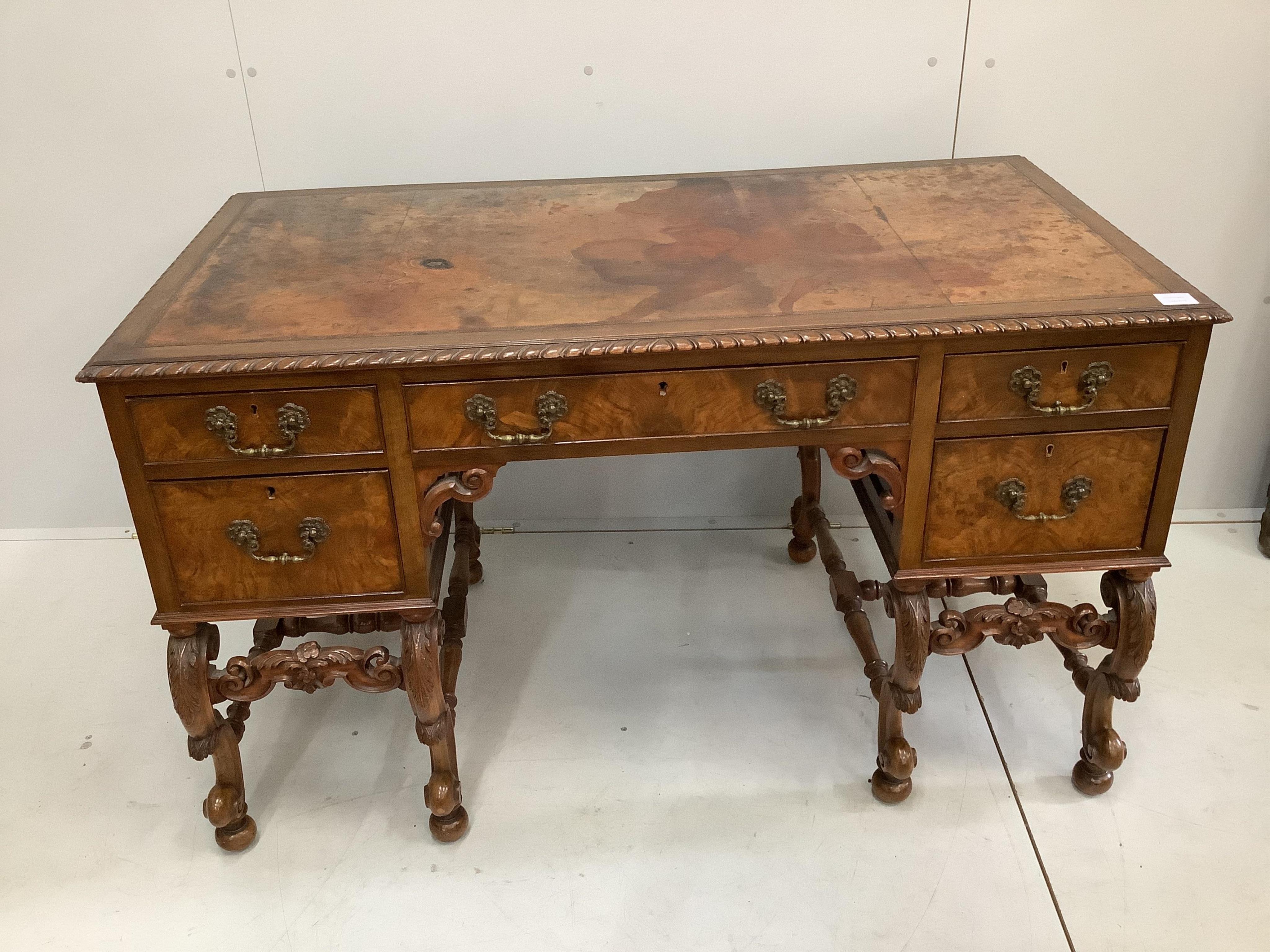 A Queen Anne Revival mahogany kneehole desk, width 129cm, depth 68cm, height 77cm. Condition - fair